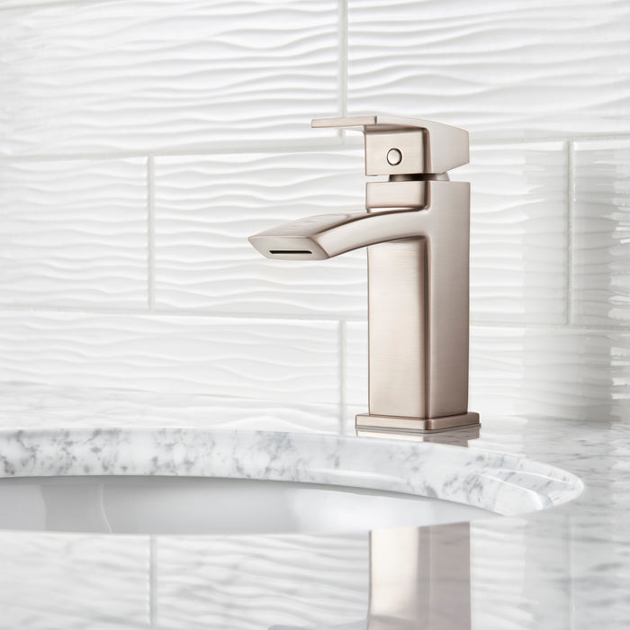 Pfister Kenzo faucet in brushed nickel installed on a modern sink with a white countertop, emphasizing its sleek and contemporary design.