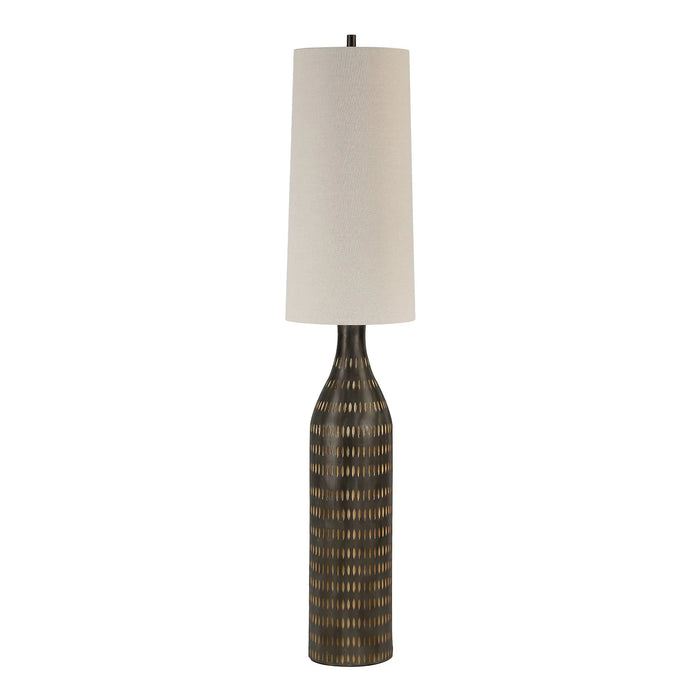 Decorative floor lamp with a textured base and oatmeal shade on a white background