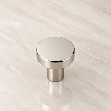 CBH 503 Minimalist Round Cabinet Knob in Bright Nickel Plated finish displayed on marble