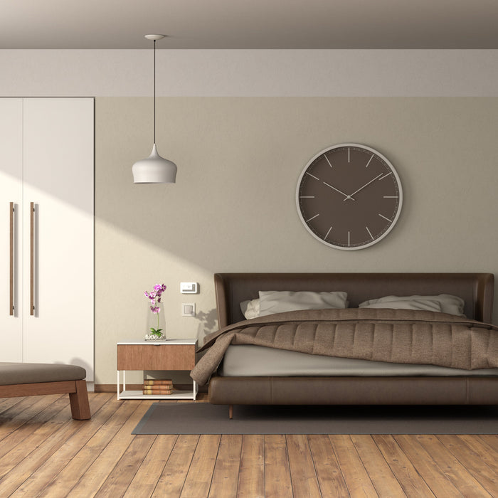 Modern bedroom with brown bed, nightstands, pendant lights, and white wardrobes with vertical handles.