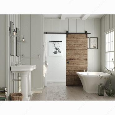 Matte Black recessed pull installed on a rustic sliding barn door