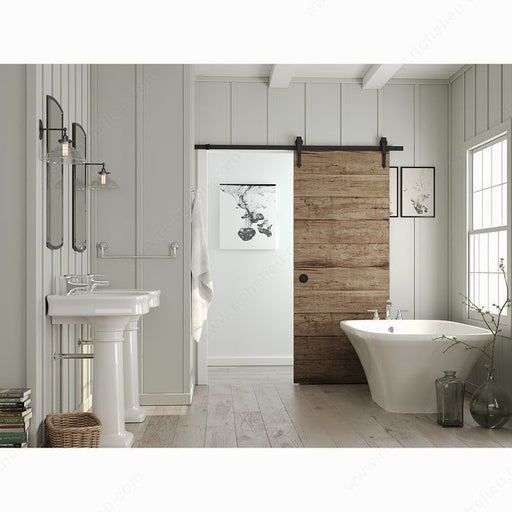 Matte Black recessed pull installed on a rustic sliding barn door