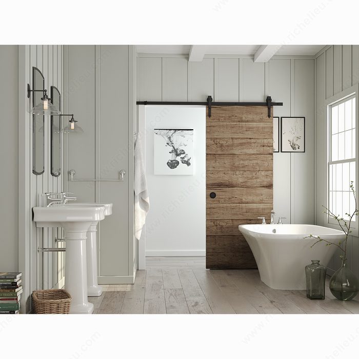 Matte Black recessed pull installed on a rustic sliding barn door
