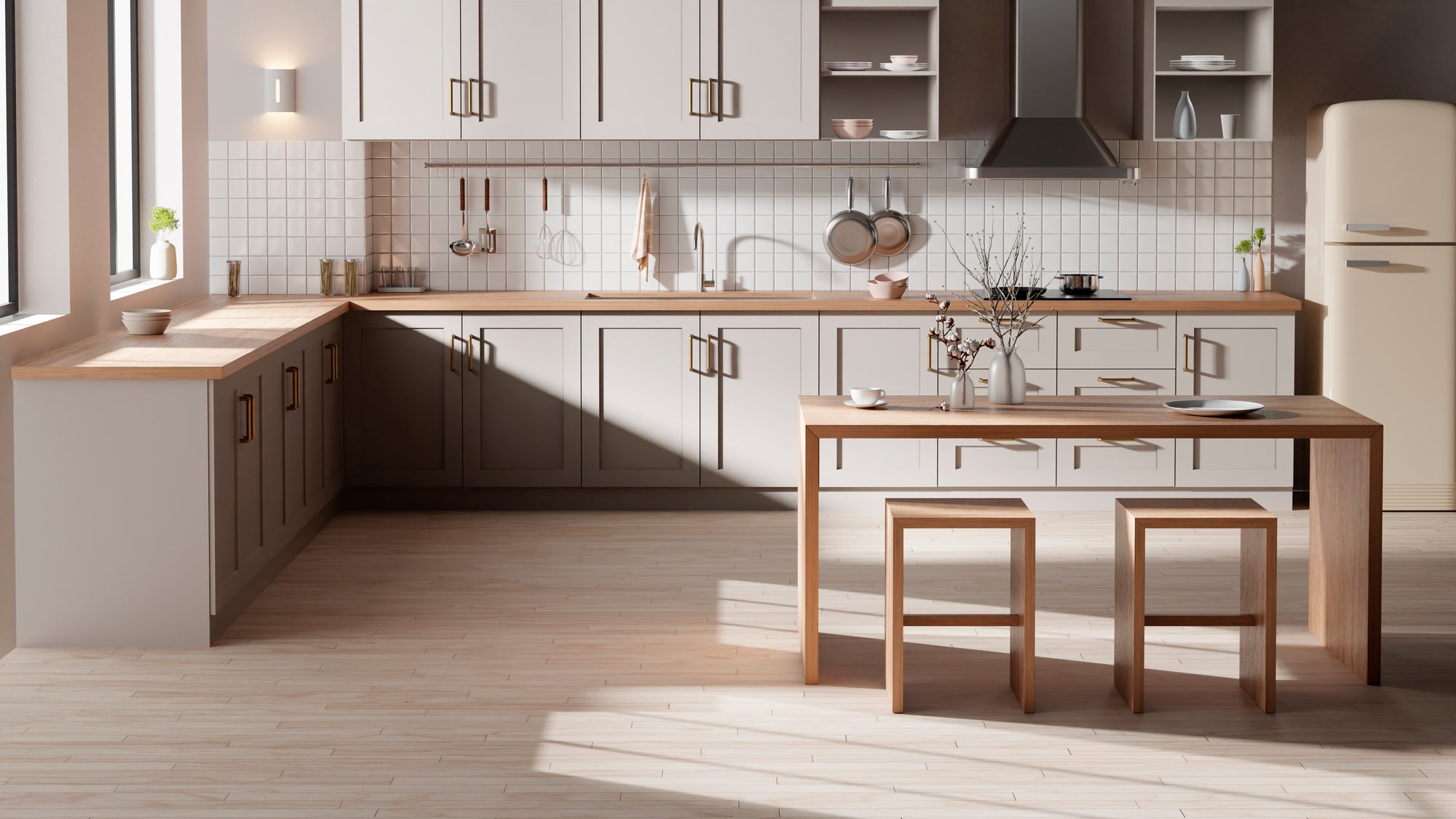 Modern kitchen with beige cabinets, wooden countertops, brass handles, and a tiled backsplash, illuminated by natural light.