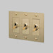 Buster + Punch 3-Gang Toggle Switch – Linear - Brass / With Logo - 3G Toggle