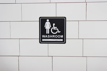 Frost 963 Washroom Signage- Female/Wheelchair with Braille Emboss, Black
