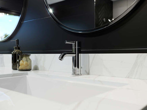 Pfister Contempra faucet in polished chrome, installed on a modern bathroom white marble countertop with  minimalist decor.