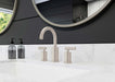 Pfister Contempra 2-handle 8-inch widespread bathroom faucet in brushed nickel, installed on a white marble countertop in a modern bathroom.