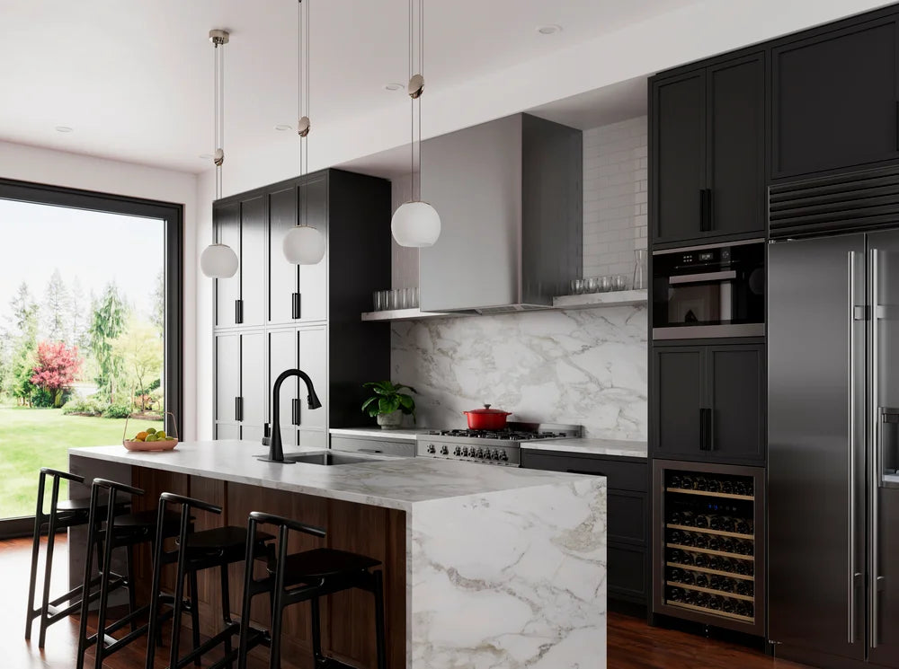 Modern kitchen with black cabinets, marble island, and stainless steel appliances.