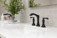 Pfister Rhen 2-handle 8-inch widespread bathroom faucet in matte black, installed on a white countertop in a contemporary bathroom.