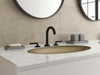 Pfister Tenet 2-handle 8-inch widespread bathroom faucet in matte black, installed on a white marble countertop in a modern bathroom.