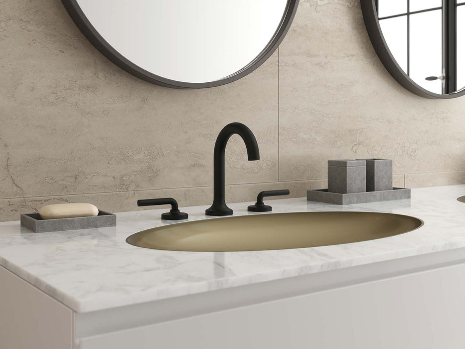 Pfister Tenet 2-handle 8-inch widespread bathroom faucet in matte black, installed on a white marble countertop in a modern bathroom.