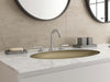 Pfister Tenet 2-handle 8-inch widespread bathroom faucet in polished chrome, installed on a white marble countertop in a contemporary bathroom.