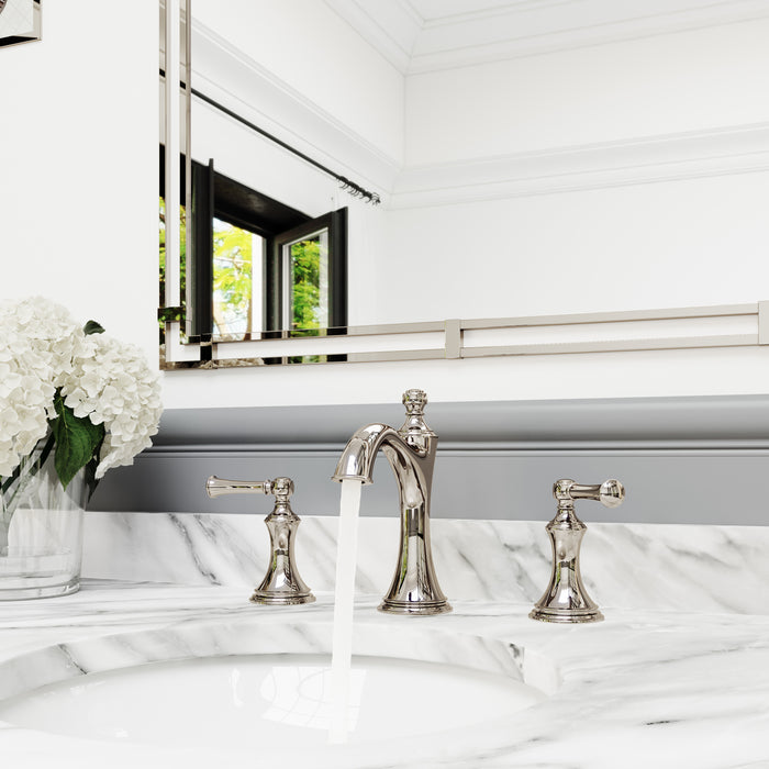 Pfister Tisbury 2-handle 8-inch widespread bathroom faucet in polished nickel, installed on a white marble countertop in a classic bathroom, with water flowing from the spout.