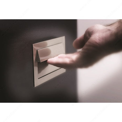 Richelieu 1011 modern recessed metal pull in brushed nickel side view showing recessed depth and sleek profile.