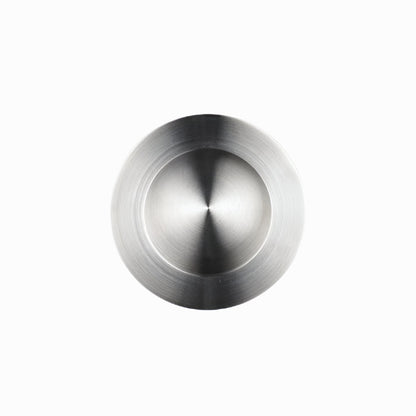 Richelieu 3402 modern recessed metal pull in brushed nickel top angle view showing circular recess and smooth profile.