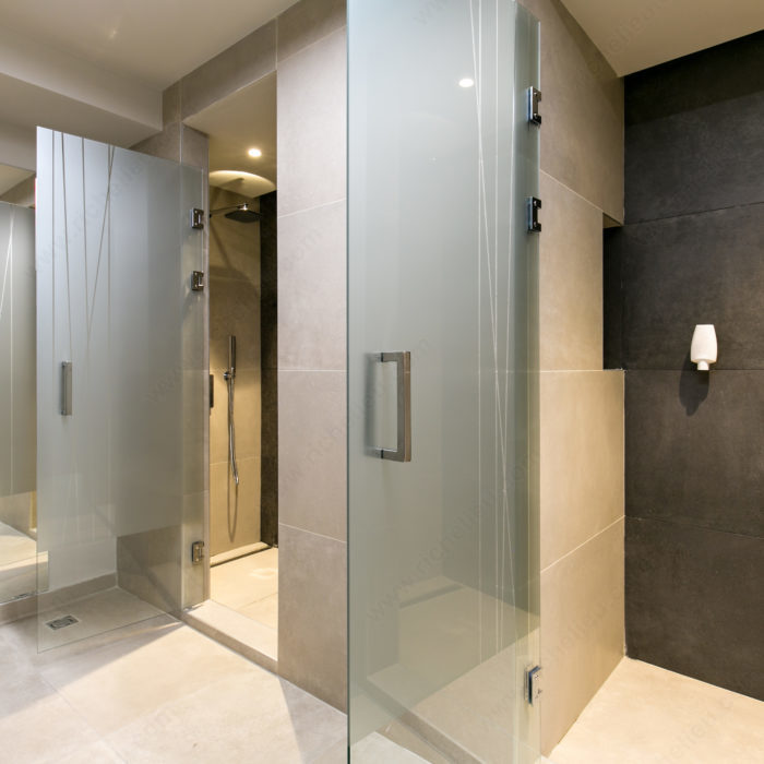 Richelieu 87D2S square tubular pull for glass doors, installed view in stainless steel on frosted shower door.