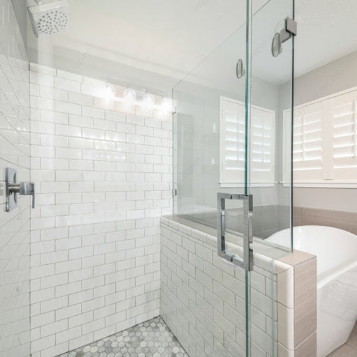 Richelieu 87D2S square tubular pull for glass doors, installed view in stainless steel on clear glass shower door.