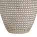 Textured table lamp with circular pattern on a white background