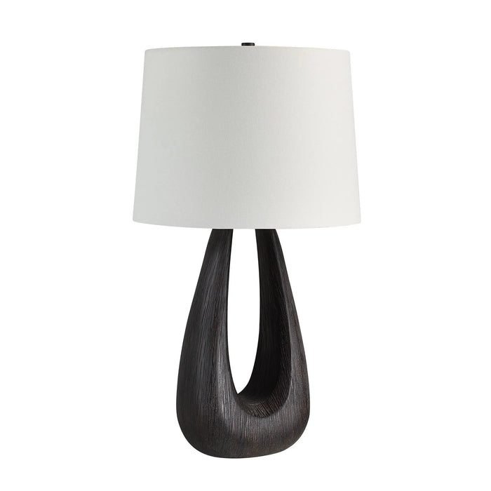 Table lamp with a dark wooden base and white lampshade on a white background