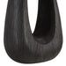 Dark sculptural wood table lamp on a white background