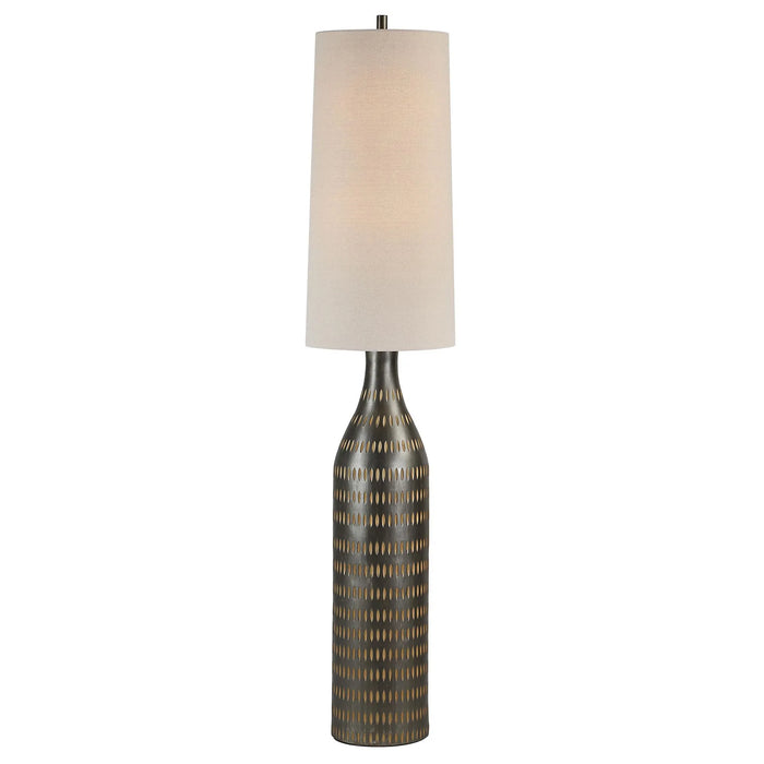 Decorative floor lamp with textured base and oatmeal shade on a white background