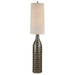 Decorative floor lamp with textured base and oatmeal shade on a white background