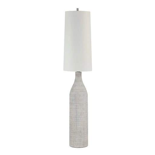 Cream textured floor lamp with an oatmeal shade on a white background