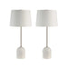Set of two entryway table lamps with marble bases on a white background