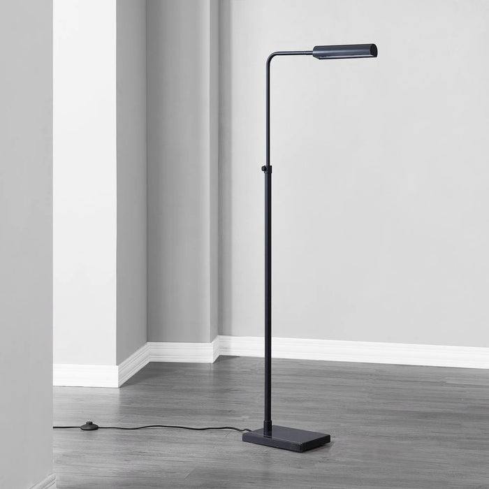 Black floor lamp in a room with gray walls and flooring