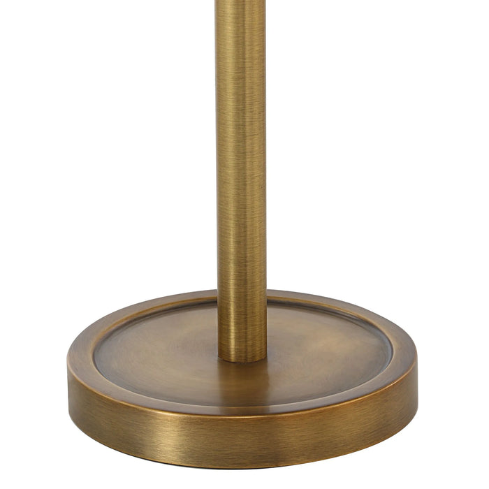 Brass-colored lamp base on a white background