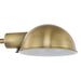 Brass-colored dome task light on a white background