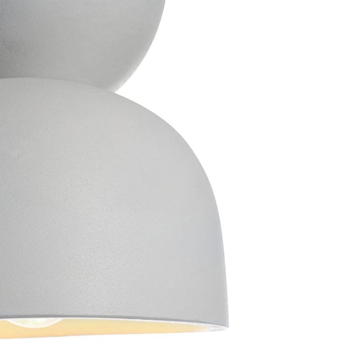 Close-up of a white pendant light on a white background