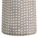 Textured lamp with a pattern of raised dots on a neutral background