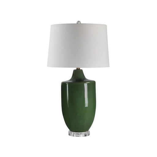 Green table lamp with a white shade on a white background