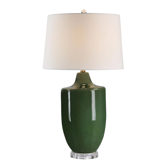 Green table lamp with a white shade on a white background