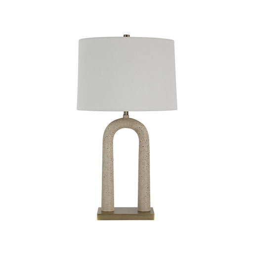 Table lamp with a textured base and white shade on a white background