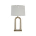 Table lamp with a textured base and white shade on a white background