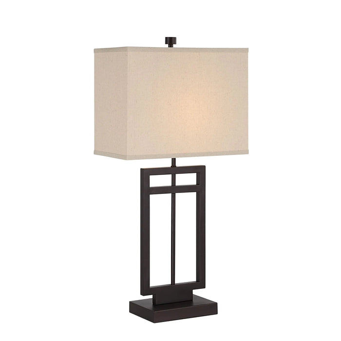Table lamp with a beige square shade and black metal base on a white background