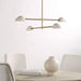 Modern chandelier with white shades and gold accents in a minimalistic room.