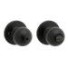 Pair of matte black door knobs with privacy function on a white background