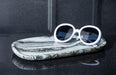 Small oblong black marble tray used to hold eyeglasses