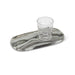 Oblong black marble serving tray styled with a drinking glass