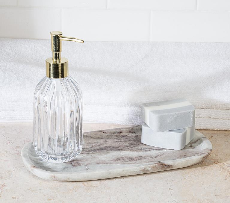 Small brown marble tray styled with a soap dispenser and decorative accessories