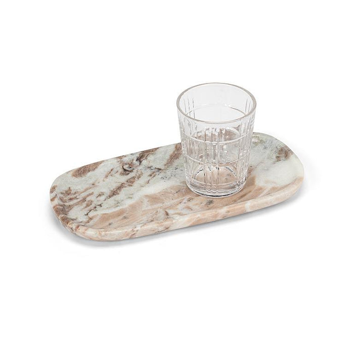 Oblong brown marble serving tray styled with a drinking glass