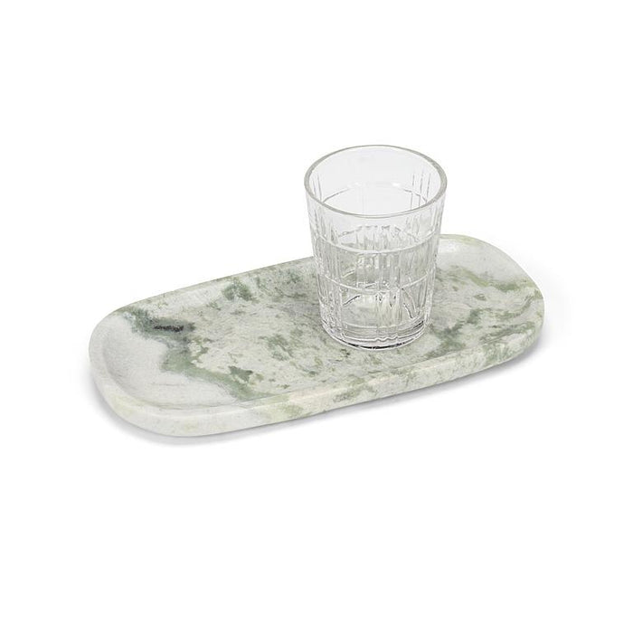 Small green marble serving tray styled with a drinking glass