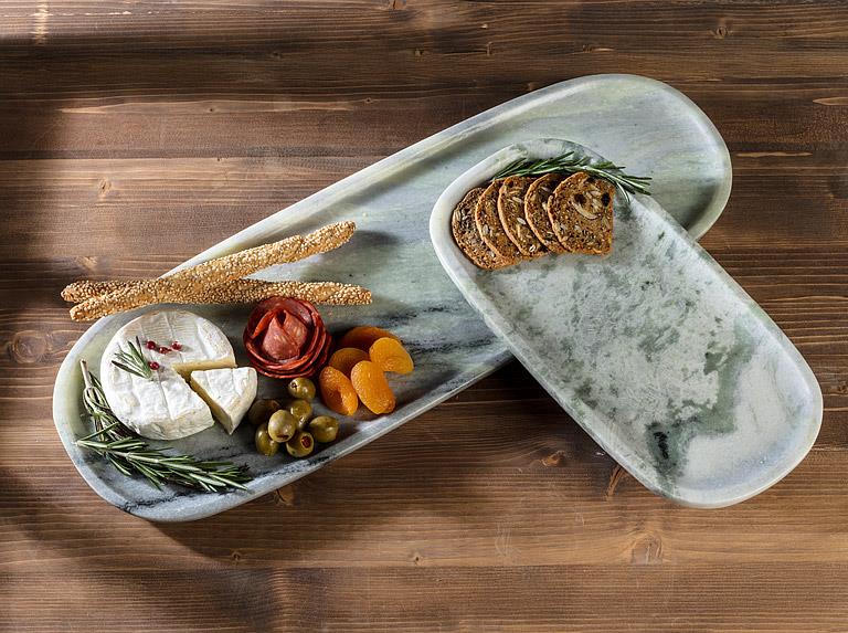 Abbott green marble trays styled with appetizers and snacks
