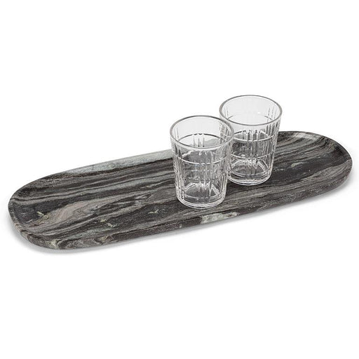 Large black marble serving tray styled with two drinking glasses