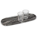 Large black marble serving tray styled with two drinking glasses