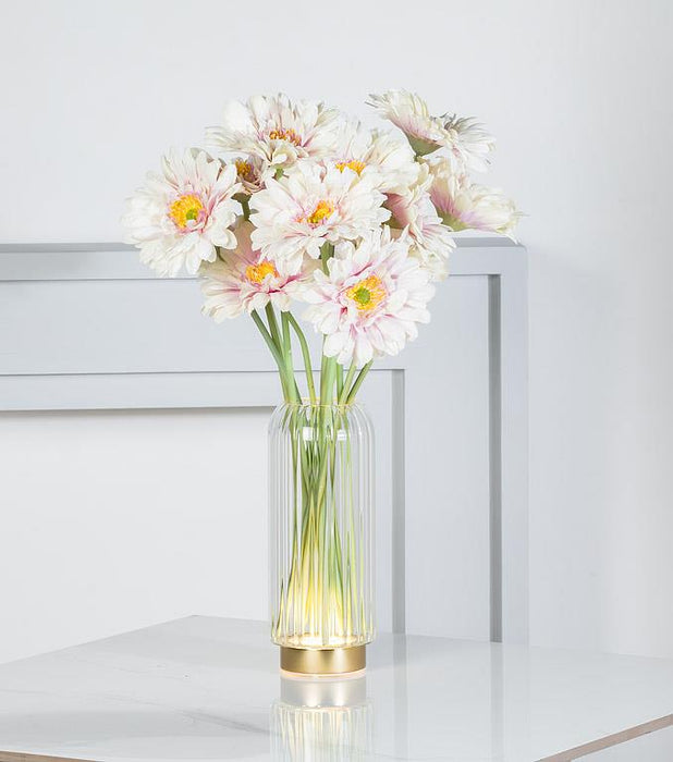 Abbott decorative LED vase glowing with warm white light and fresh floral arrangement
